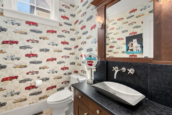 a bathroom with a sink toilet and vanity