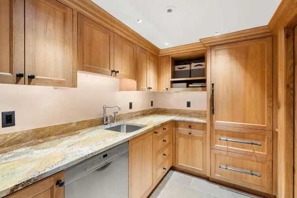 a kitchen with a sink and cabinets