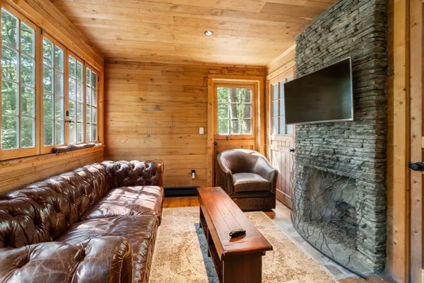 a bedroom with furniture and a fireplace