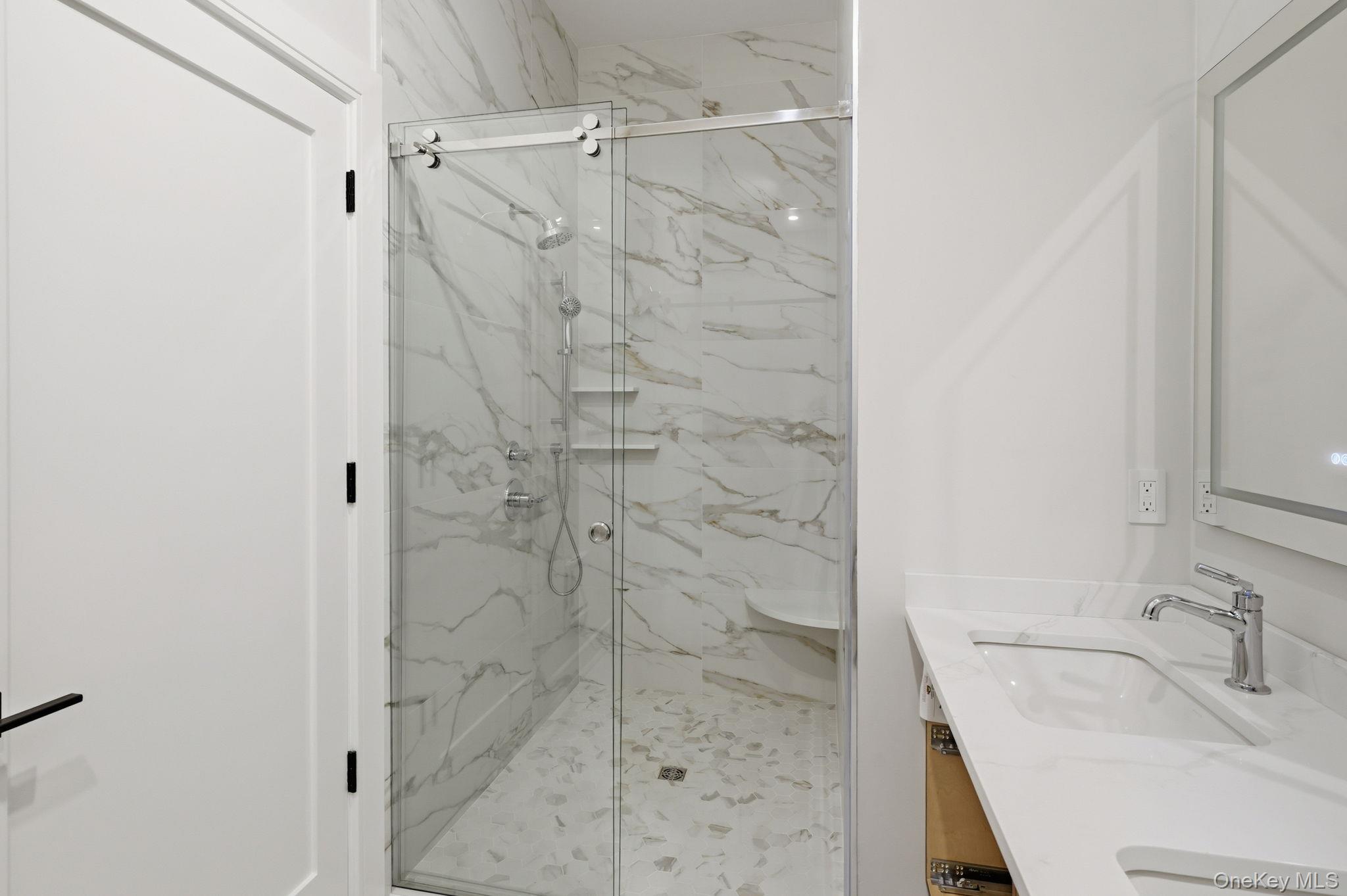 34 Clinton Avenue, Unit 5D Dobbs Ferry, NY 10522 - Photo 8 of 13 a bathroom with a sink and shower