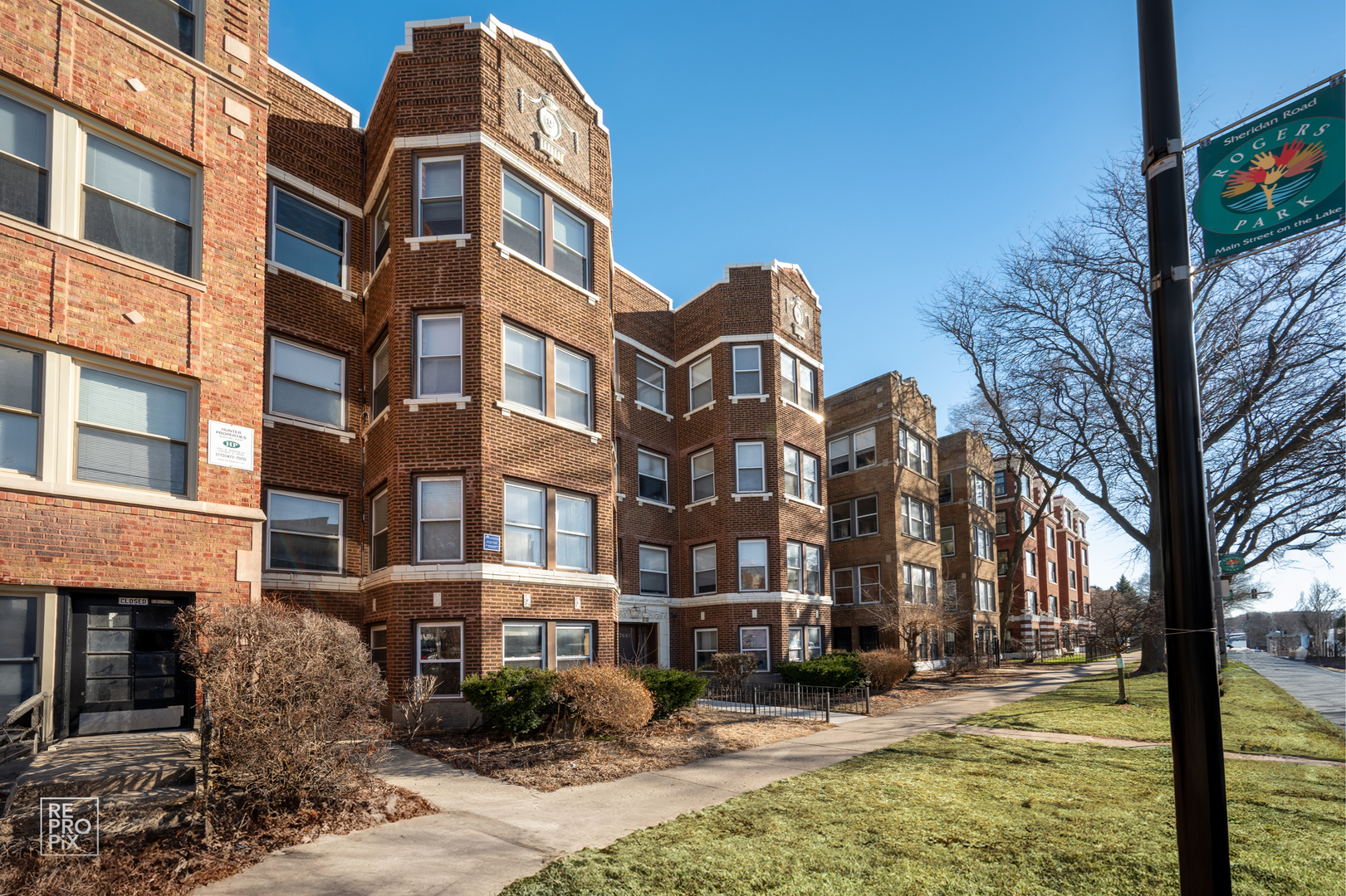 7661 North Sheridan Road Chicago, IL 60626 - Photo 4 of 19 a front view of a building with street view