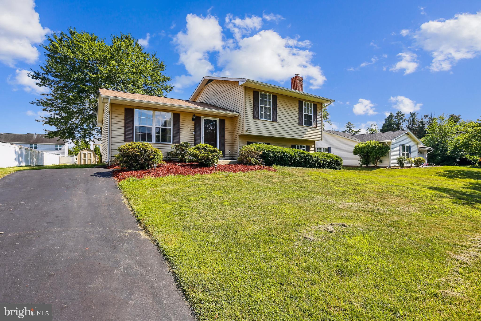 8225 Grainfield Road Severn, MD 21144 - Photo 2 of 35 a front view of house with yard and green space