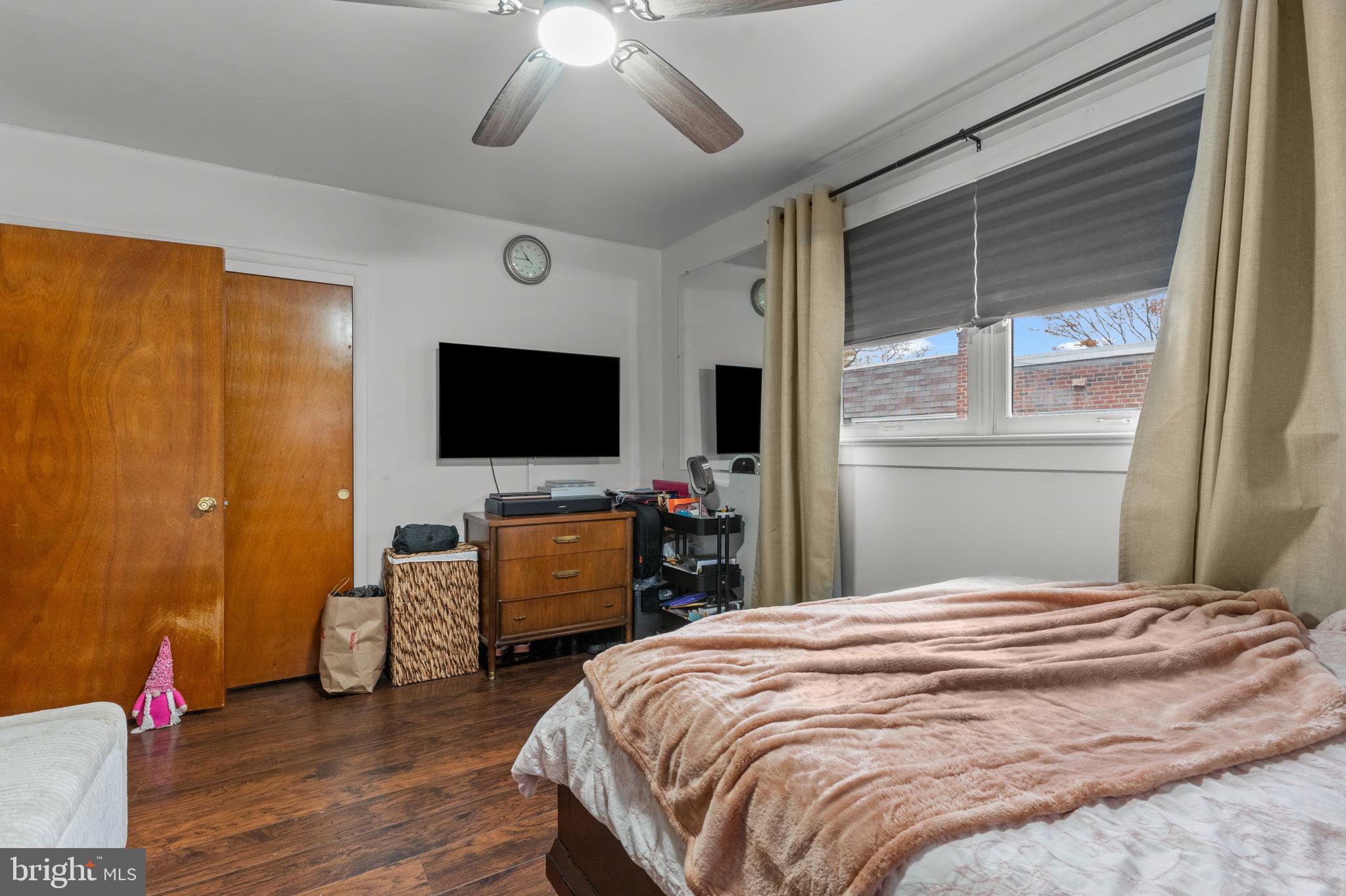 1117 Surrey Road Philadelphia, PA 19115 - Photo 11 of 24 a bedroom with a bed and a flat screen tv