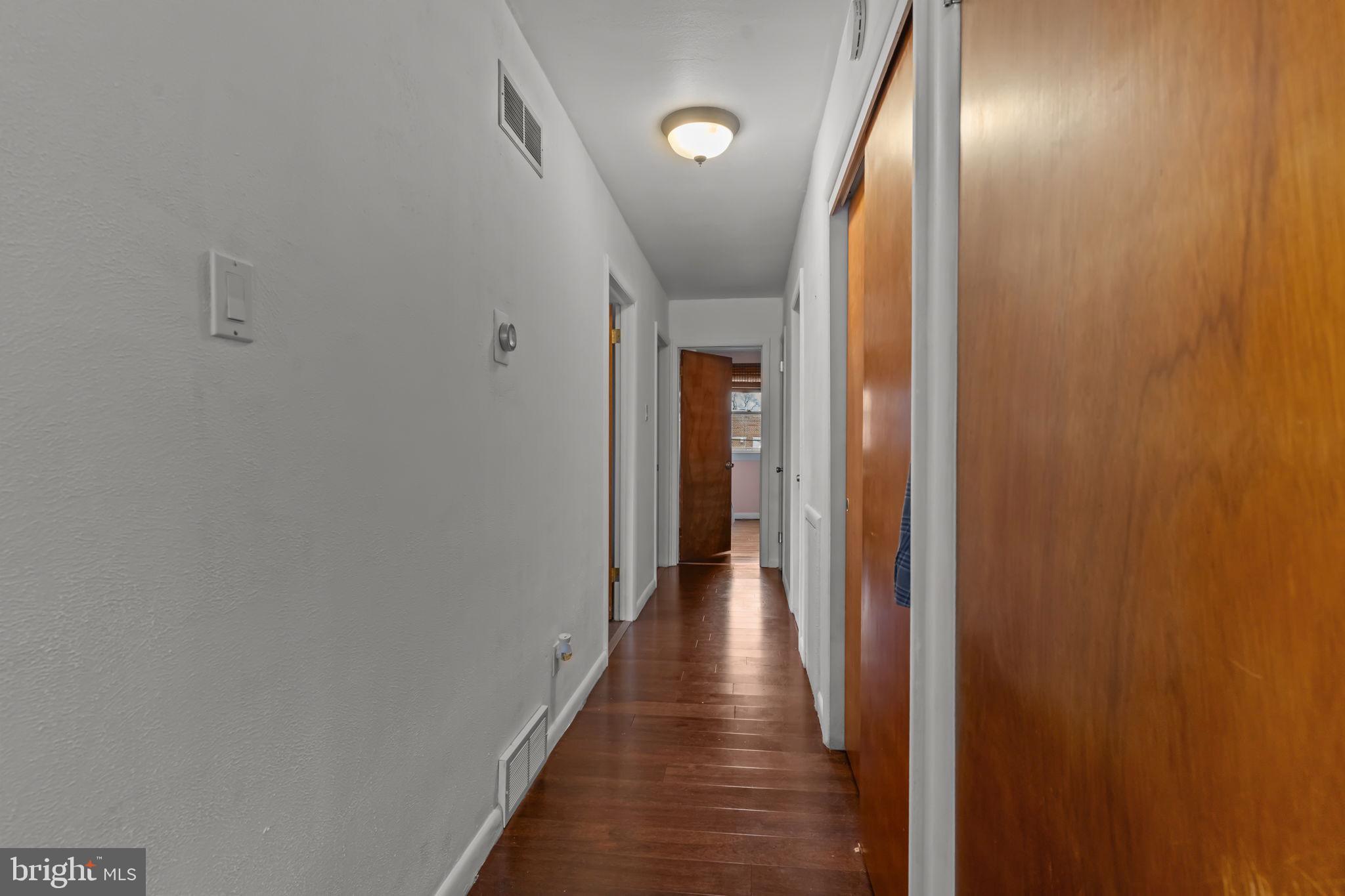 1117 Surrey Road Philadelphia, PA 19115 - Photo 15 of 24 a view of hallway with wooden floor