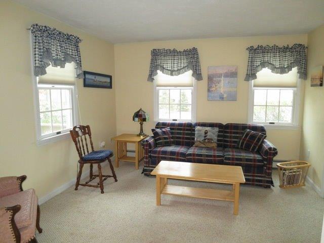 62 Riverside Road Mashpee, MA 02649 - Photo 8 of 13 a living room with furniture and a window