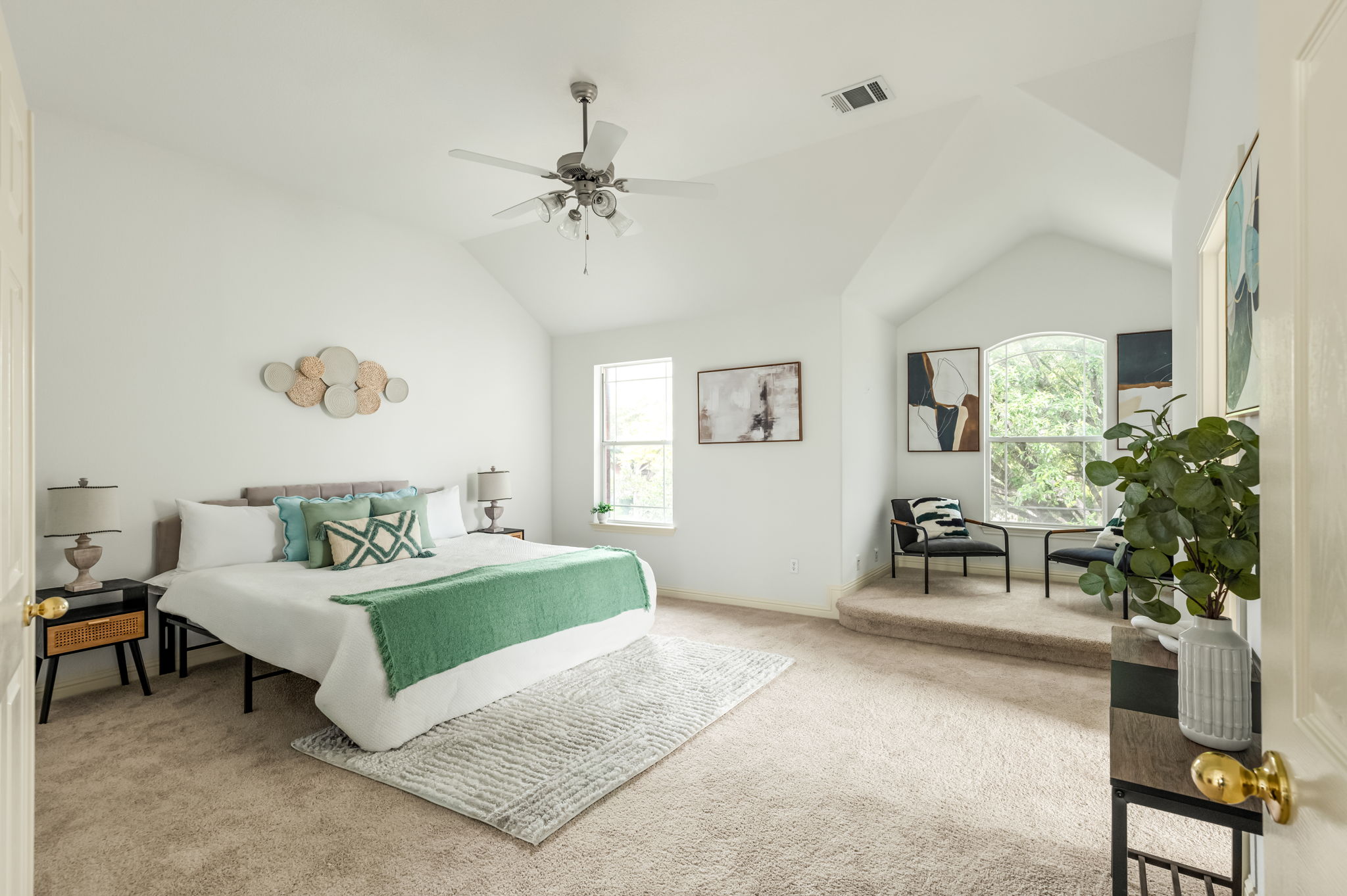 10004 Isle Royale Way Austin, TX 78747 - Photo 19 of 31 A spacious sleeping area with vaulted ceilings and a comfortable reading nook invites tranquil relaxation.