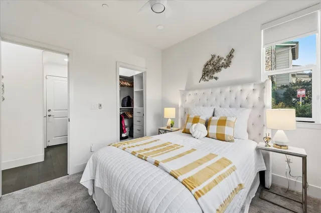 a bedroom with a bed and a table in it