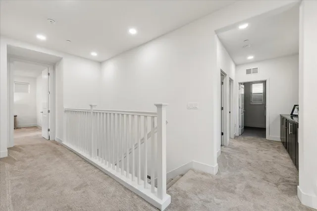 a bedroom with bed and a chandelier