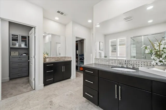a bathroom with a bathtub and shower