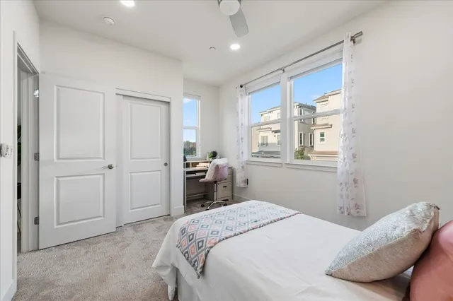 a bathroom with a double vanity sink and a toilet