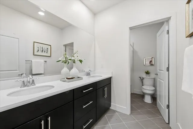 a bedroom with a bed and a table