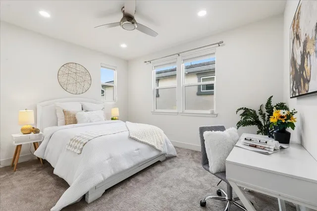 a bedroom with a bed and a view of bathroom