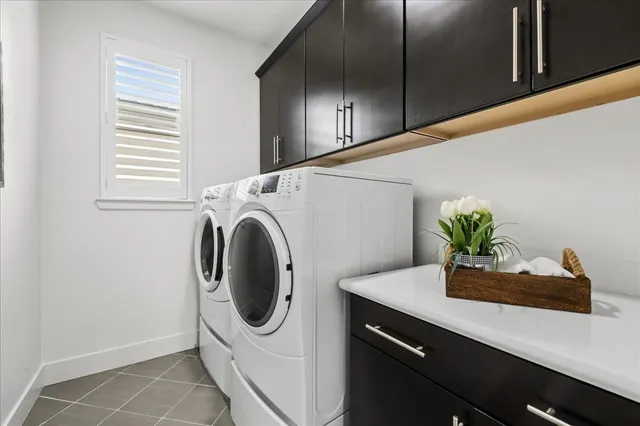 a view of a patio with couches table and chairs and potted plants