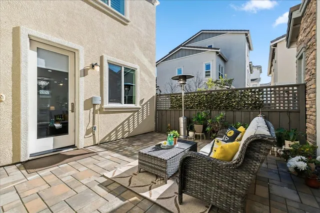 a view of house with patio and outdoor seating