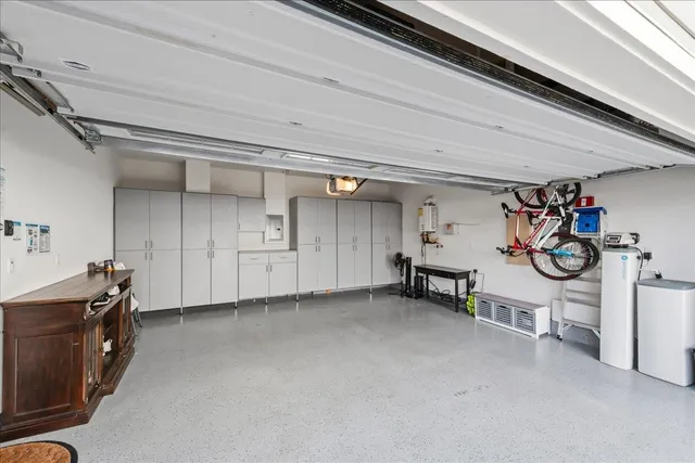 a view of a house with a window and potted plants