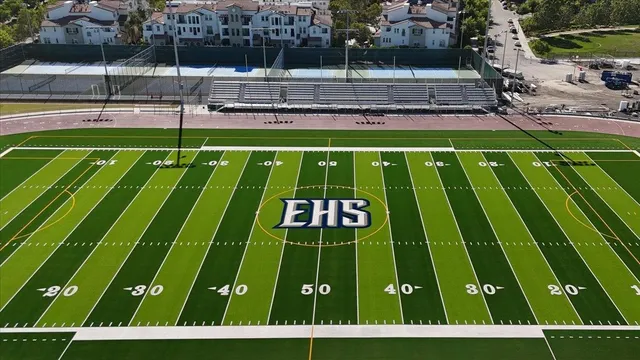 a picture of a bench in front of a wall