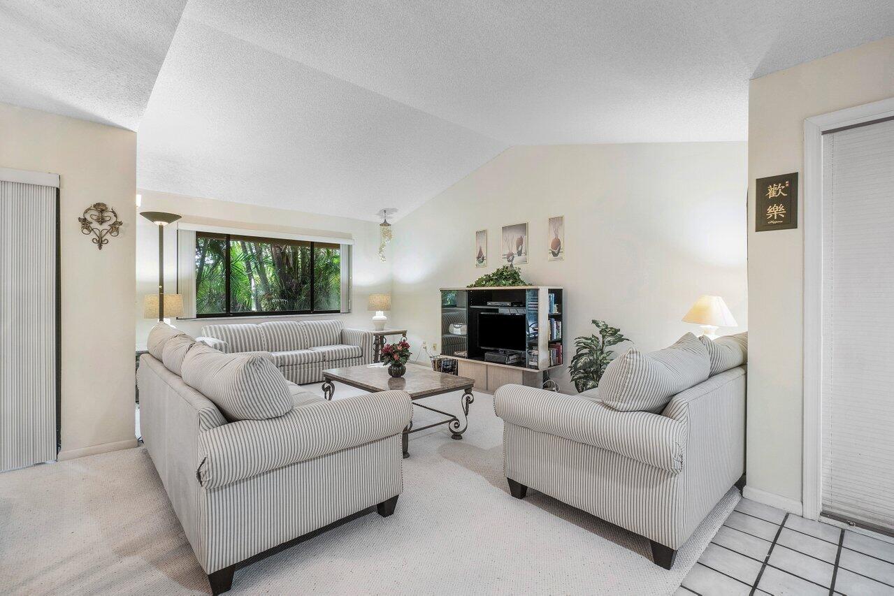 5650 Coach House Circle, Unit D Boca Raton, FL 33486 - Photo 5 of 32 VAULTED CEILINGS IN LIVING ROOM