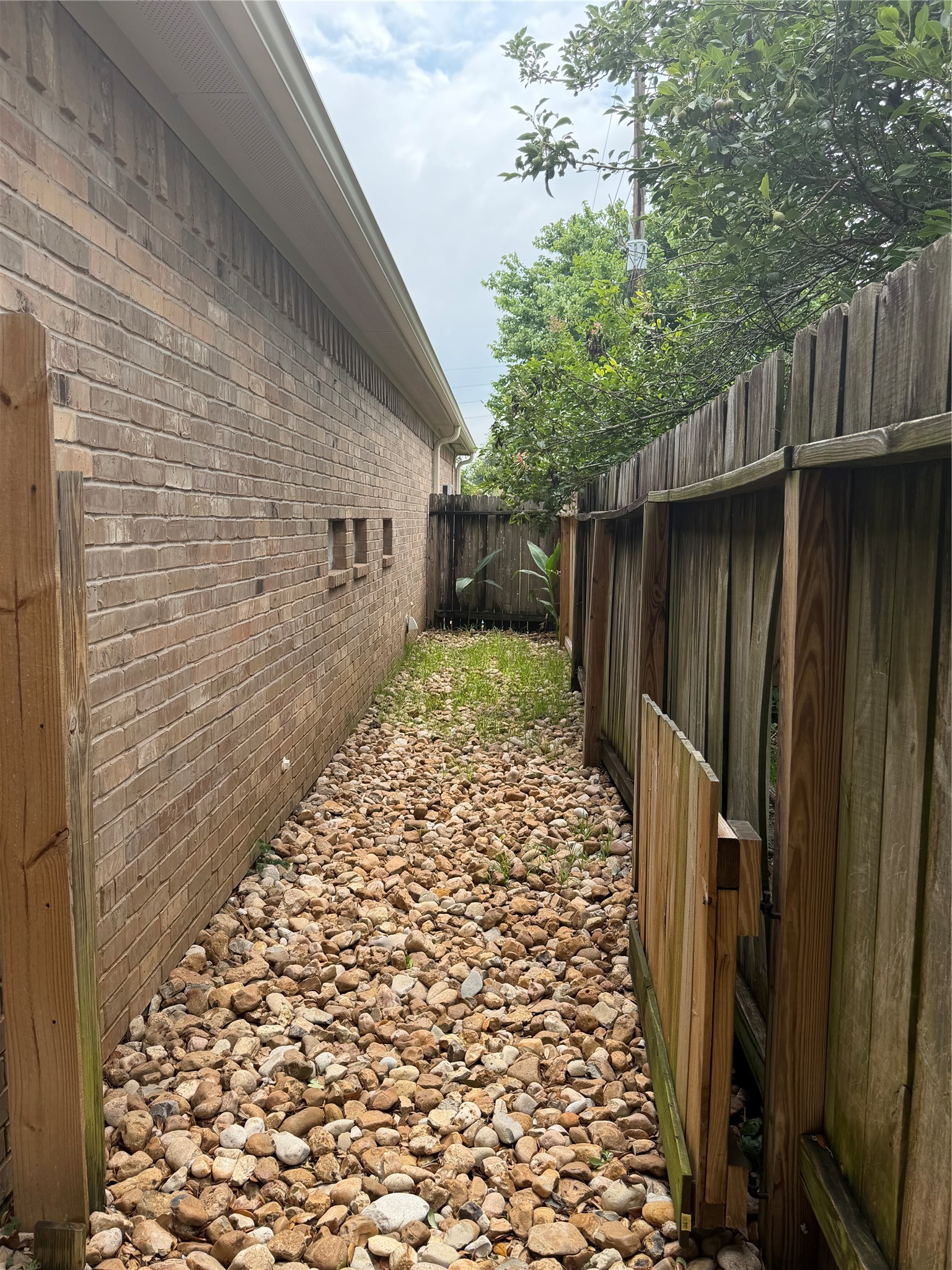903 Cascade Ridge Katy, TX 77494 - Photo 22 of 24 a backyard of a house with wooden fence