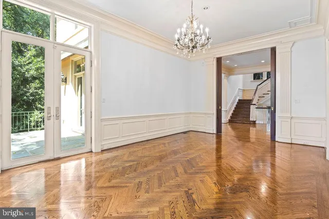 a view of an empty room and window