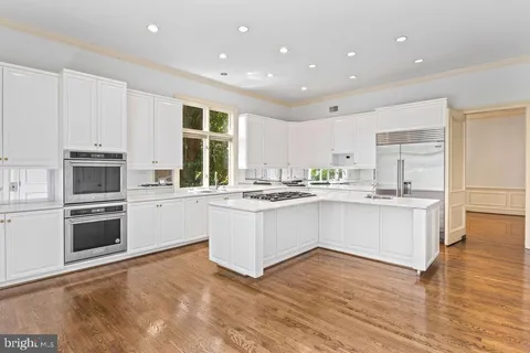 a view of a hallway with a living room