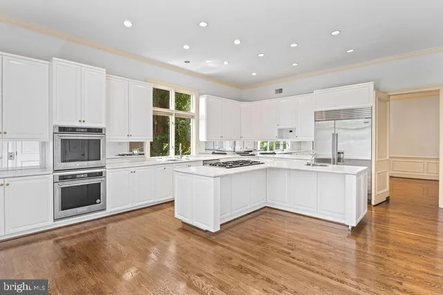 a view of a hallway with a living room