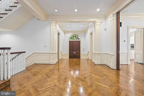 a view of a livingroom with a fireplace wooden floor and window
