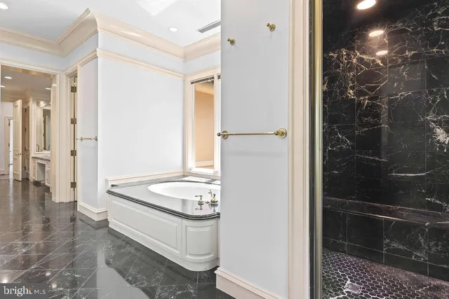 a bathroom with a double vanity sink and a bathtub