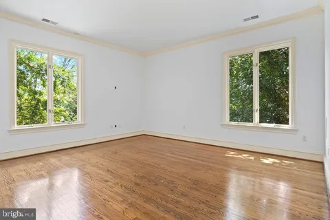 a bathroom with a granite countertop shower sink vanity and toilet