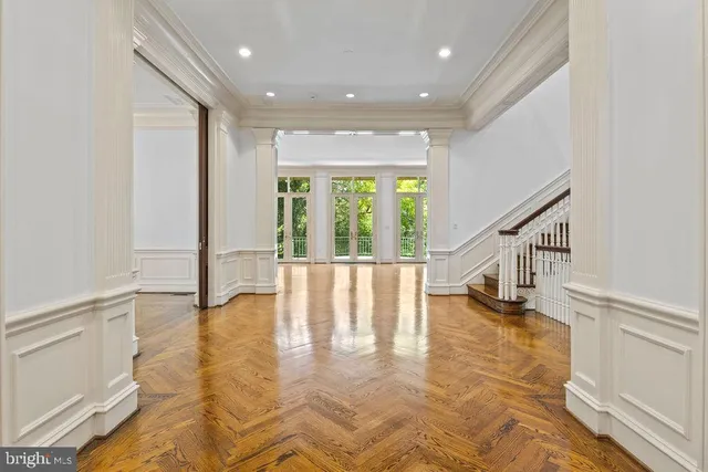a view of an entryway with wooden floor