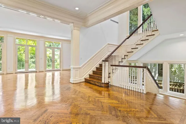 a view of an entryway with wooden floor