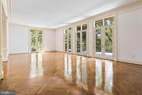 a view of an entryway with wooden floor