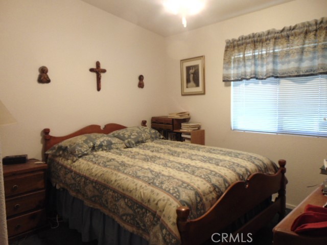 3835 Gardiner Ferry Road, Unit 62 Corning, CA 96021 - Photo 22 of 34 a bedroom with a bed and a dresser