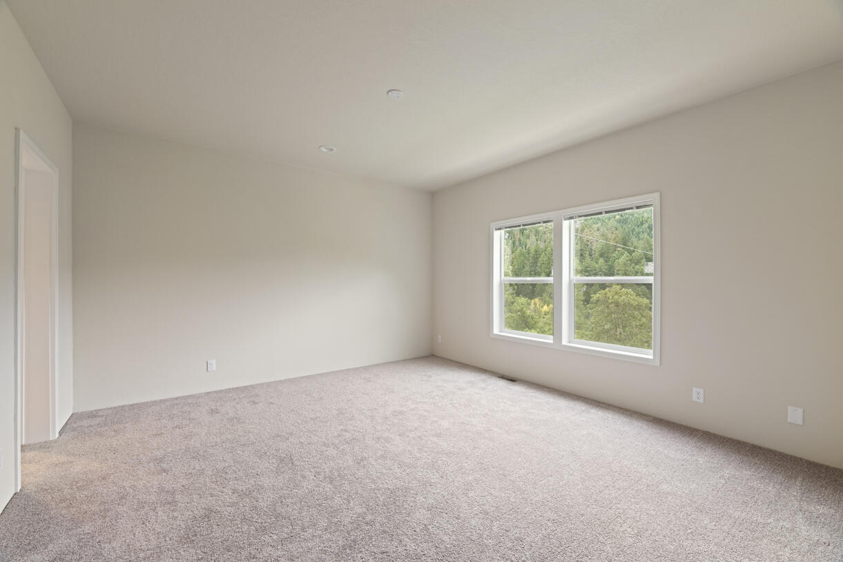 5572 Jumpoff Joe Creek Road Grants Pass, OR 97526 - Photo 4 of 38 an empty room with a window