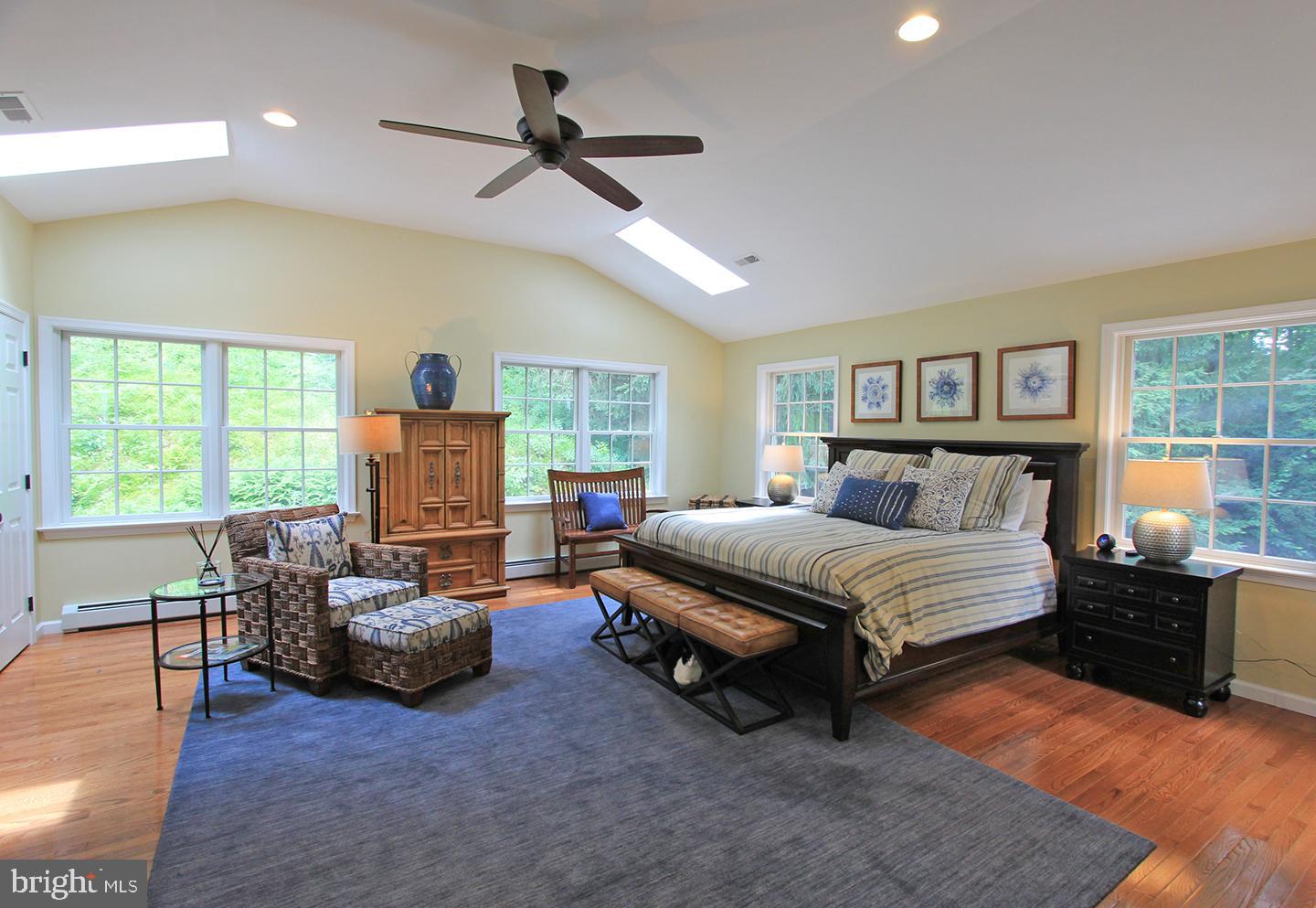 594 Contention Lane Berwyn, PA 19312 - Photo 11 of 15 a spacious bedroom with a bed and a couch