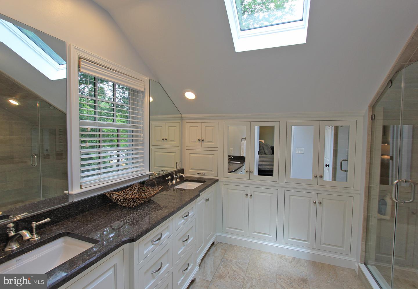 594 Contention Lane Berwyn, PA 19312 - Photo 12 of 15 a kitchen with granite countertop a sink window and cabinets