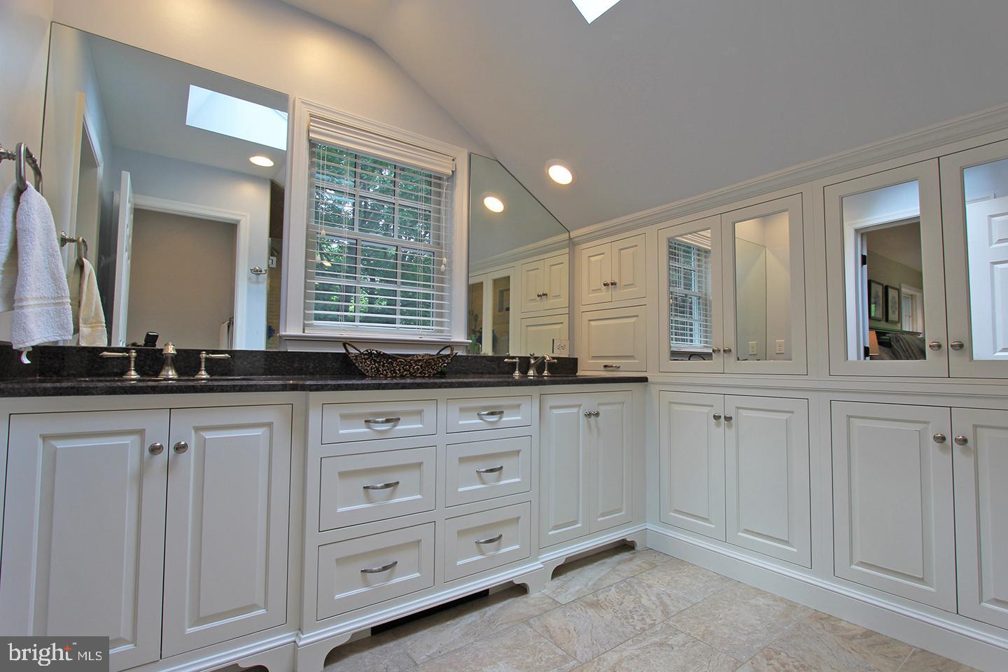 594 Contention Lane Berwyn, PA 19312 - Photo 13 of 15 a bathroom with white cabinets and a sink