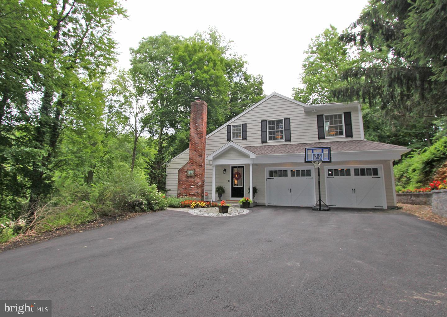 594 Contention Lane Berwyn, PA 19312 - Photo 3 of 15 a view of house with yard and trees in the background