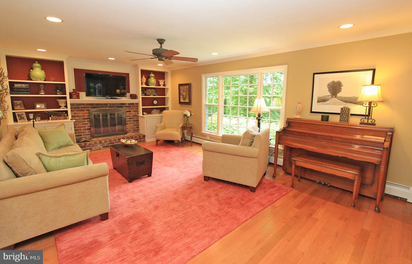 594 Contention Lane Berwyn, PA 19312 - Photo 6 of 15 a living room with fireplace furniture and a flat screen tv