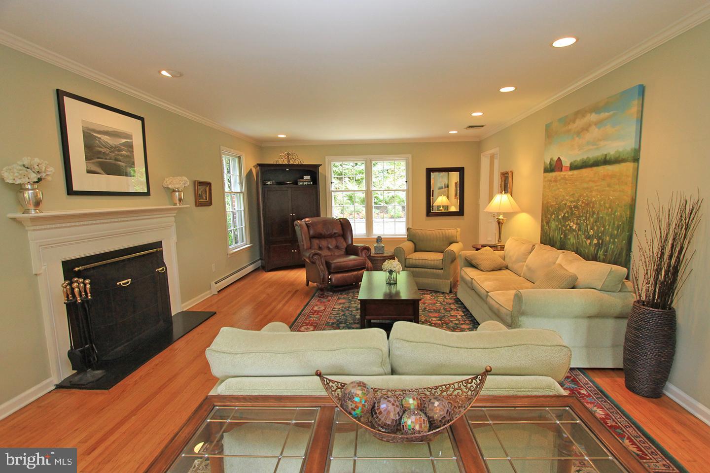 594 Contention Lane Berwyn, PA 19312 - Photo 7 of 15 a living room with furniture fireplace and wooden floor