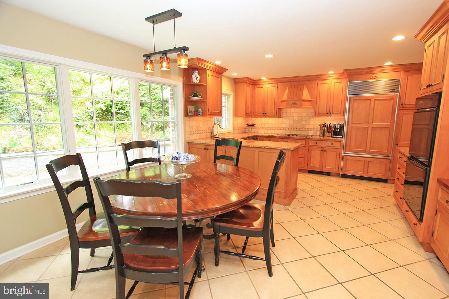 594 Contention Lane Berwyn, PA 19312 - Photo 8 of 15 a view of a dining room with furniture window and outside view