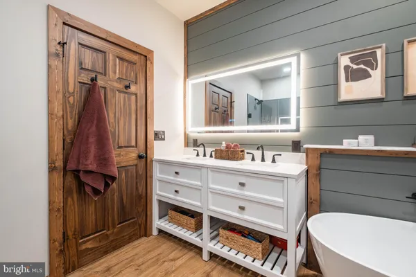 a bathroom with a shower toilet and sink