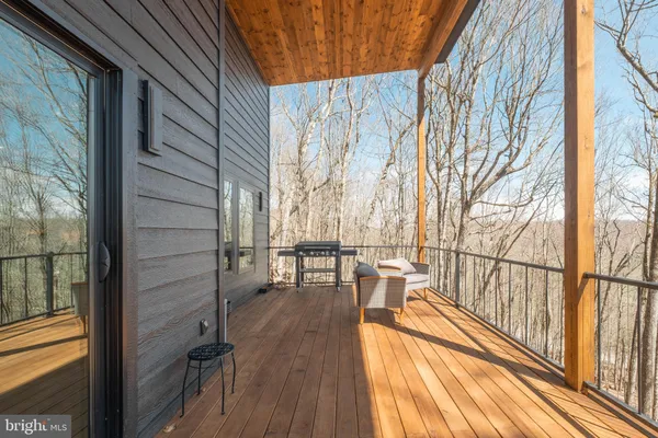 a building outdoor space with patio furniture and garden