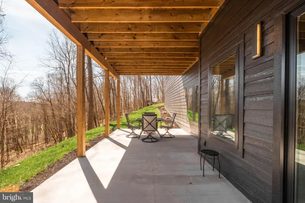 a view of house with a outdoor seating area