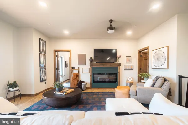 a living room with furniture and a fireplace