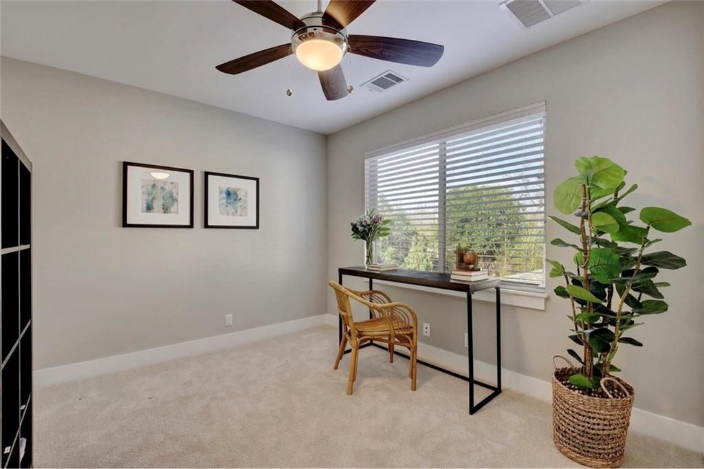 701 East 49th Street, Unit B Austin, TX 78751 - Photo 17 of 27 Office area featuring light carpet and ceiling fan