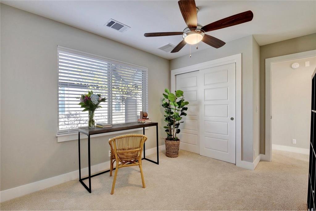 701 East 49th Street, Unit B Austin, TX 78751 - Photo 18 of 27 Office with light carpet and a ceiling fan