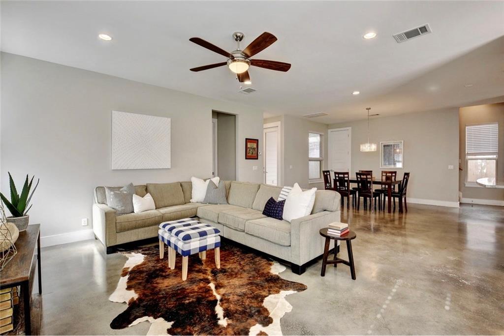 701 East 49th Street, Unit B Austin, TX 78751 - Photo 2 of 27 Living area with finished concrete flooring, recessed lighting, and ceiling fan