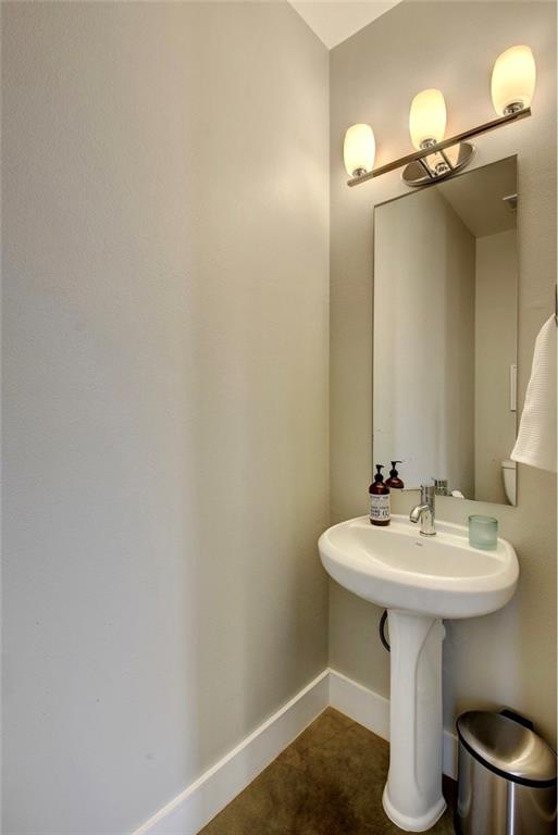 701 East 49th Street, Unit B Austin, TX 78751 - Photo 22 of 27 Bathroom with baseboards and dark tile patterned floors