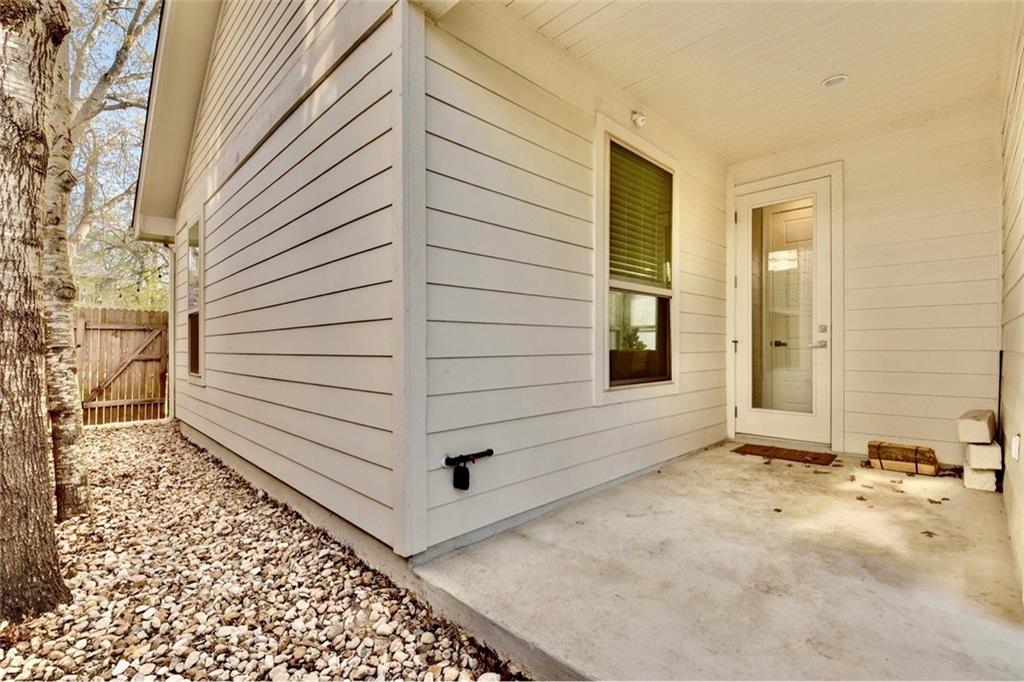 701 East 49th Street, Unit B Austin, TX 78751 - Photo 26 of 27 View of side of property with a patio area and a gate