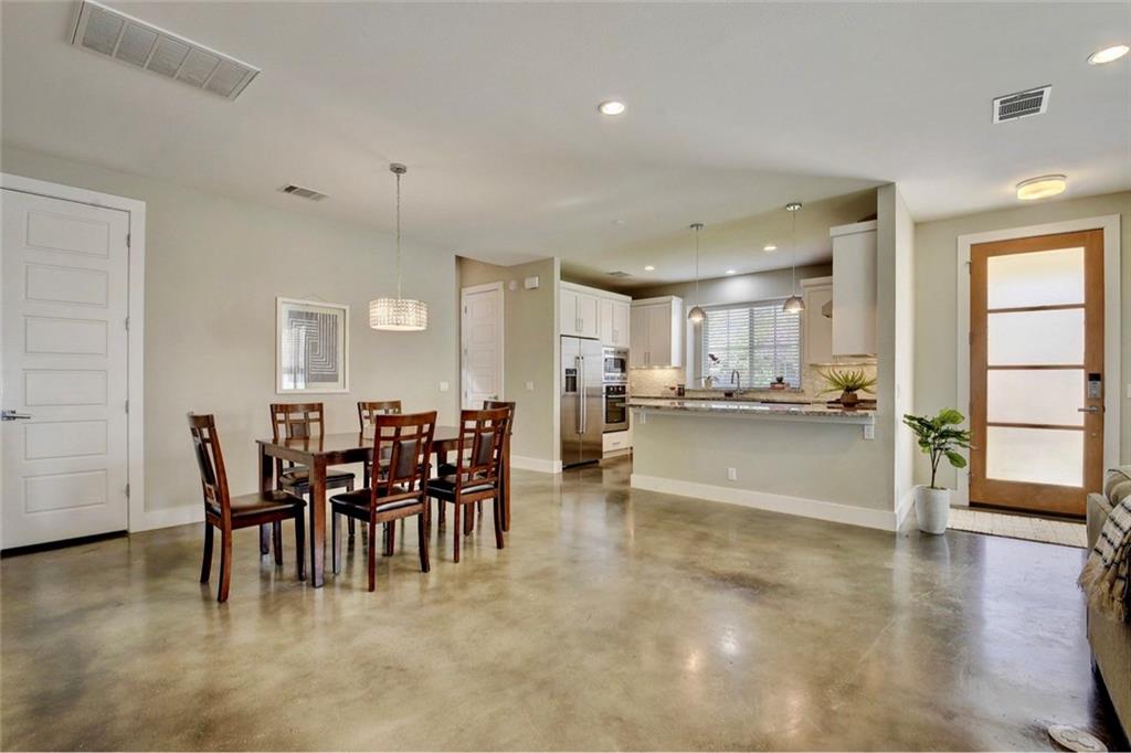 701 East 49th Street, Unit B Austin, TX 78751 - Photo 9 of 27 Dining room with concrete flooring and recessed lighting